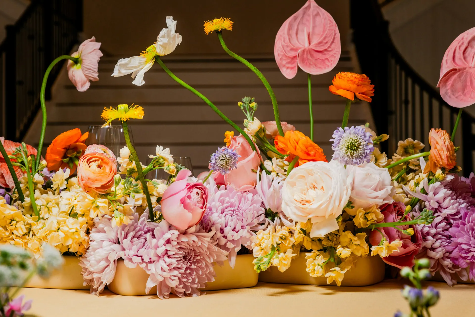 Colorful faux floral tablescape at a wedding reception